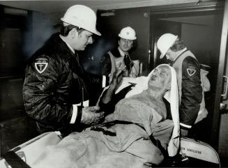 Ambulance attendants brought this man out of the hotel on a stretcher