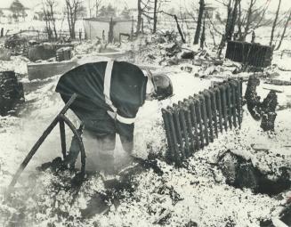 Fire-blackened radiators lie in the snow after fire burned a nursing home in Coulds, Nfld