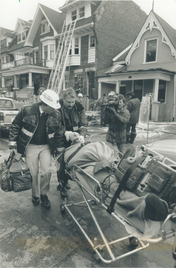 Rooming house fire injures 4. An emergency crew helps one of four people injured yesterday in a fire on Homewood Ave. In the Jarvis St.-Bloor St. E. a(...)