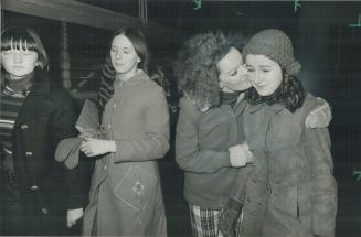 A passenger from the bus involved in the crash on Highway 400, Rhonwyn Evans, 15, of New Liskeard, is greeted in Toronto by a cousin, nurse Susan White