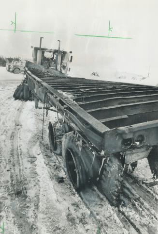 The tractor-trailer involved in the 33-vehicle crash on Highway 400 Sunday, its steel frame twisted by the intense heat of burning cars, was barred, u(...)