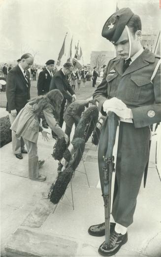 Bowed heads show the solemnity of the occasion as Etobicoke honors its war dead in a wreath laying ceremony at the civic centre Sunday. F/S Creig Mitc(...)