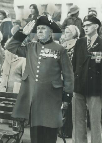 Salute from a pensioner. Chelsea pensioner Thomas Dougmore, 77, who is visiting his daughter in Metro, salutes and stands at attention today at Rememb(...)