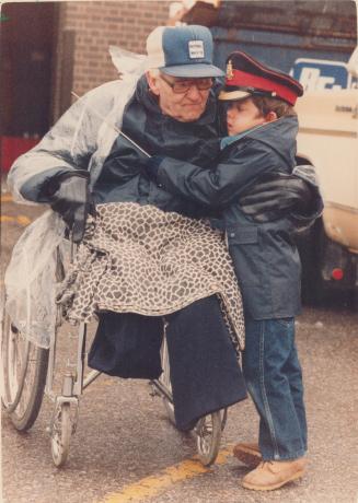 Young and old remember. Little Jimmy Bradley, 5, and his grandfather, Mark Bradley, 80, who was in the Royal Regiment of Canada, participated in the G(...)