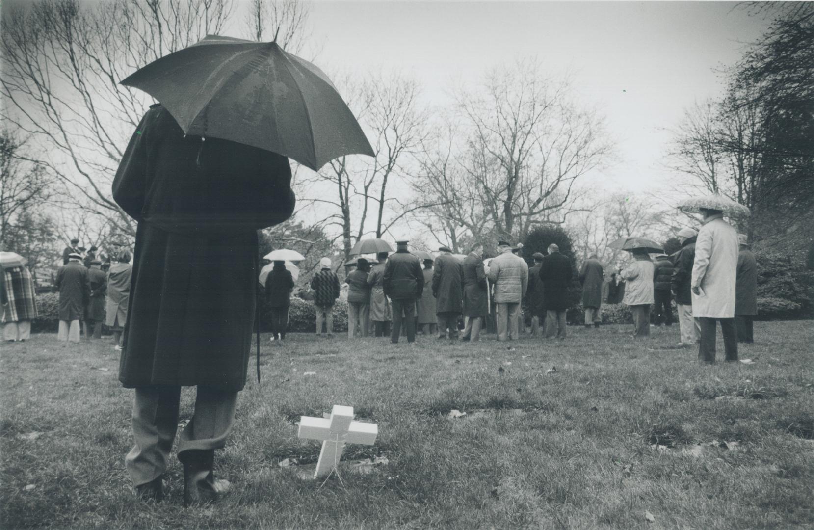 Shared event: World War II veteran Alan Leybourne stands beside his dad's grave at the Prospect Cemetery service yesterday