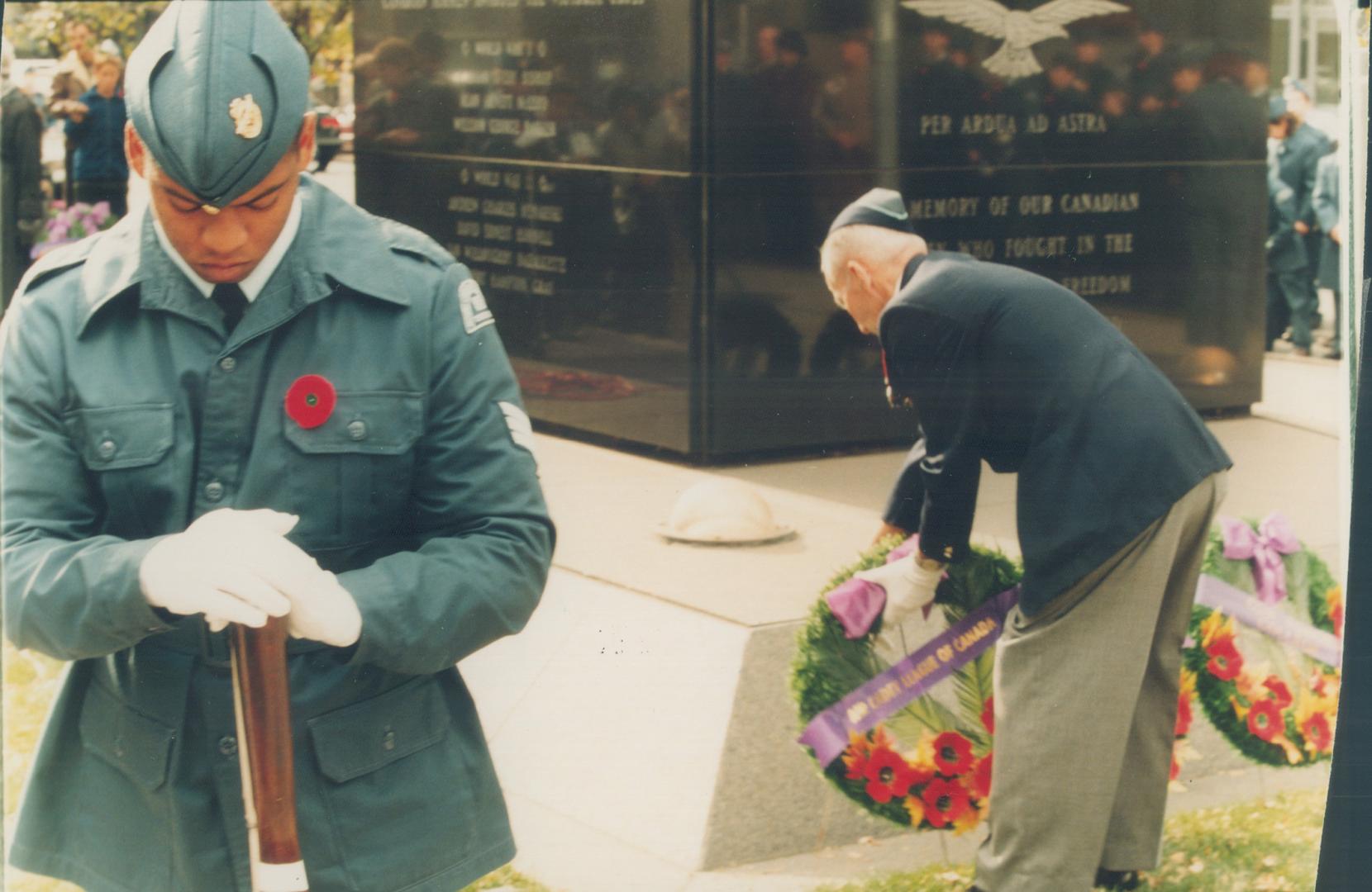 Sgt. Vincent Dos Santos of the Cadet League of Canada stands on guard while veteran Dan Dillon honours Canadians who fought and died in war by laying (...)