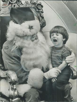 All smiles, a moment later. Two-and-a-half-year-old Steven Rowe didn't really take to Santa Claus as he was asked what he wanted for Christmas at Eato(...)