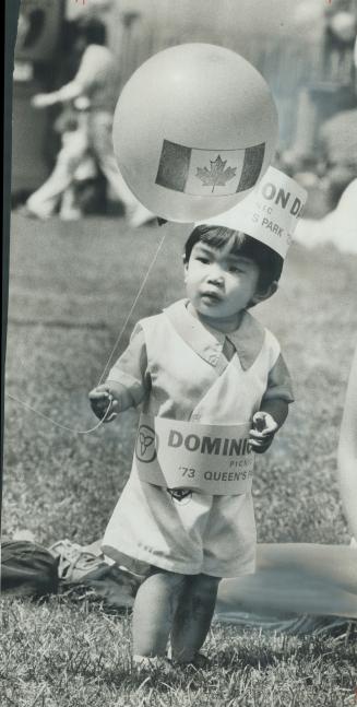 Happy birthday, Canada! Celebrating Canada's 106th birthday party is Mark Petierre, 16 months old, who along with 15,000 others, attended the giant pr(...)