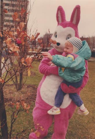 The Easter Bunny comes out in the open to help Magda Price, 2 1/2m harvest brightly colored eggs featured at the Easterfest yesterday in Mel Lastman S(...)