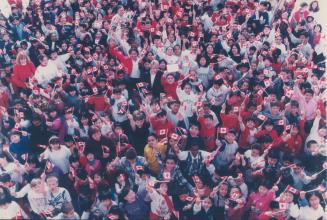 Doing the wave. Hundreds of students at St. Henry Catholic School in Scarborough wave Canadian flags yesterday to celebrate Heritage Day, the 33rd bir(...)