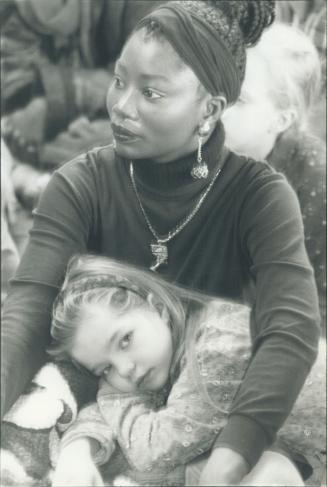 Taking a break: Teacher Josie Aberdeen and her student, Amanda Le Brun, 7, were among thousands enjoying Martinsday festivities at Harbourfront yesterday