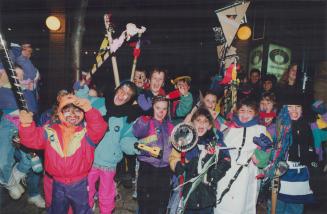 Youngsters with painted faces whoop it up on Front St