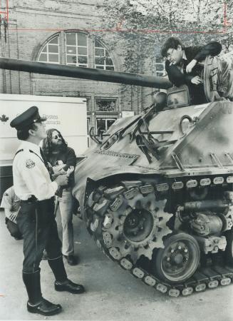 Explaining away a tank crash. A 24,000-ton Sherman tank of World War II vintage that had been on display at CNE accidentally gunned down a mail truck (...)