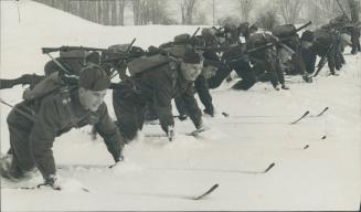 Down on all fours goes a squad of future instructors, practising the bear walk for crossing snow against enemy fire