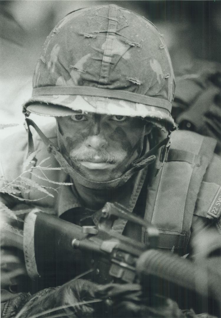 Sharp lookout: Pte. Daniel Meyer of the 22nd Service Battalion, from London, Ont., helps guard field hospital at during the militia's annual field training exercise