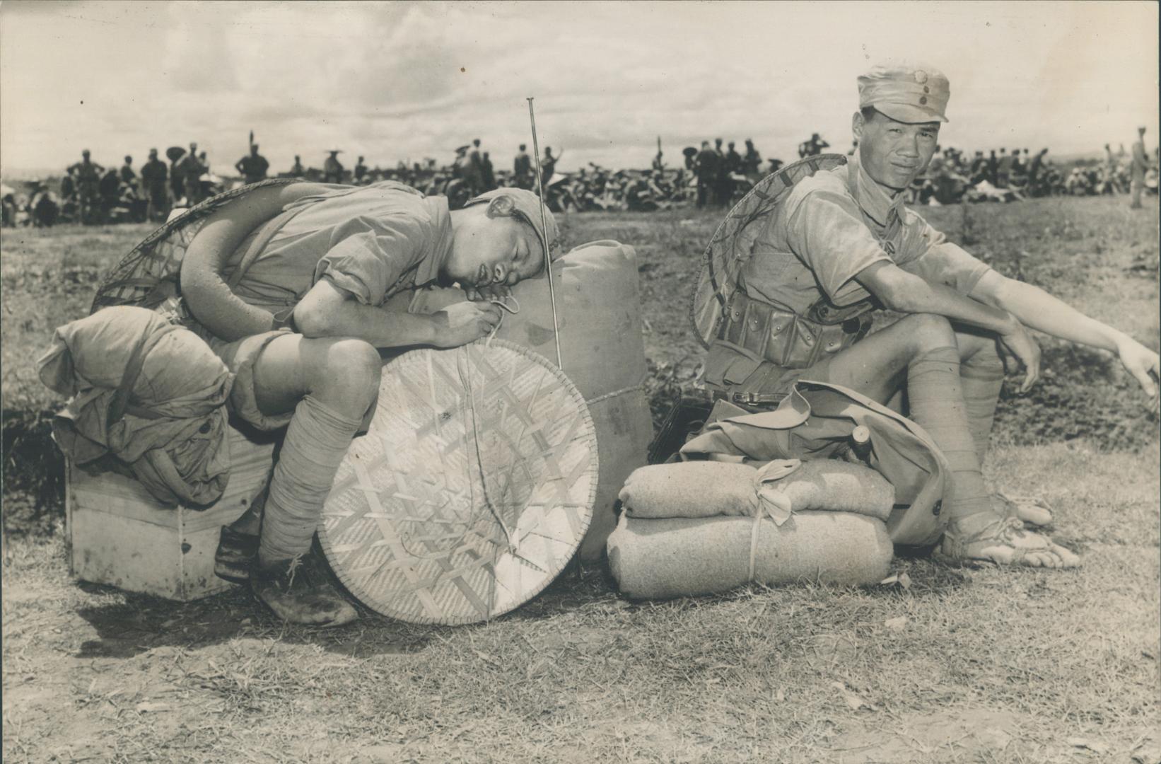 As he waits to be flown to the Burma front, this Chinese soldier snoozes