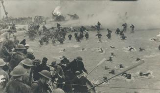 Fiercely attacked by Stuka dive bombers, British Tommies wade and swim to rescue boats standing off the beach at Dunkirk. Along with other pictures on(...)