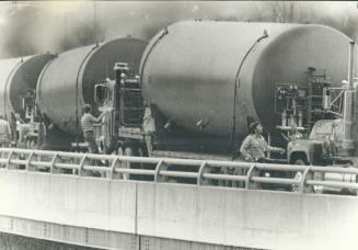 Convoy of giant tankers arrives to carry away contaminated water used to cool the reactor