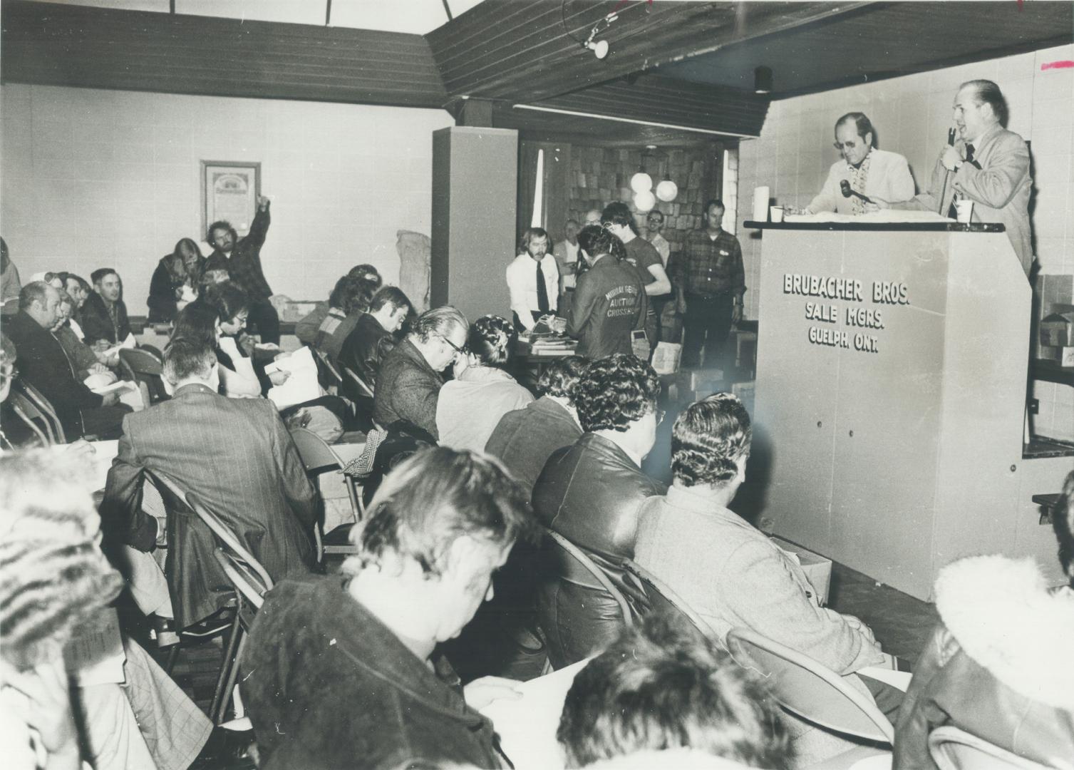 Crowds jam the three-day auction, Goods are worth $250,000 but will sell for $60,000