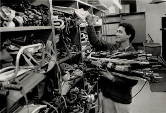 Bundling Brollies: Robert Cito loads up with lost umbrellas as the TTC prepares them for sale in lots