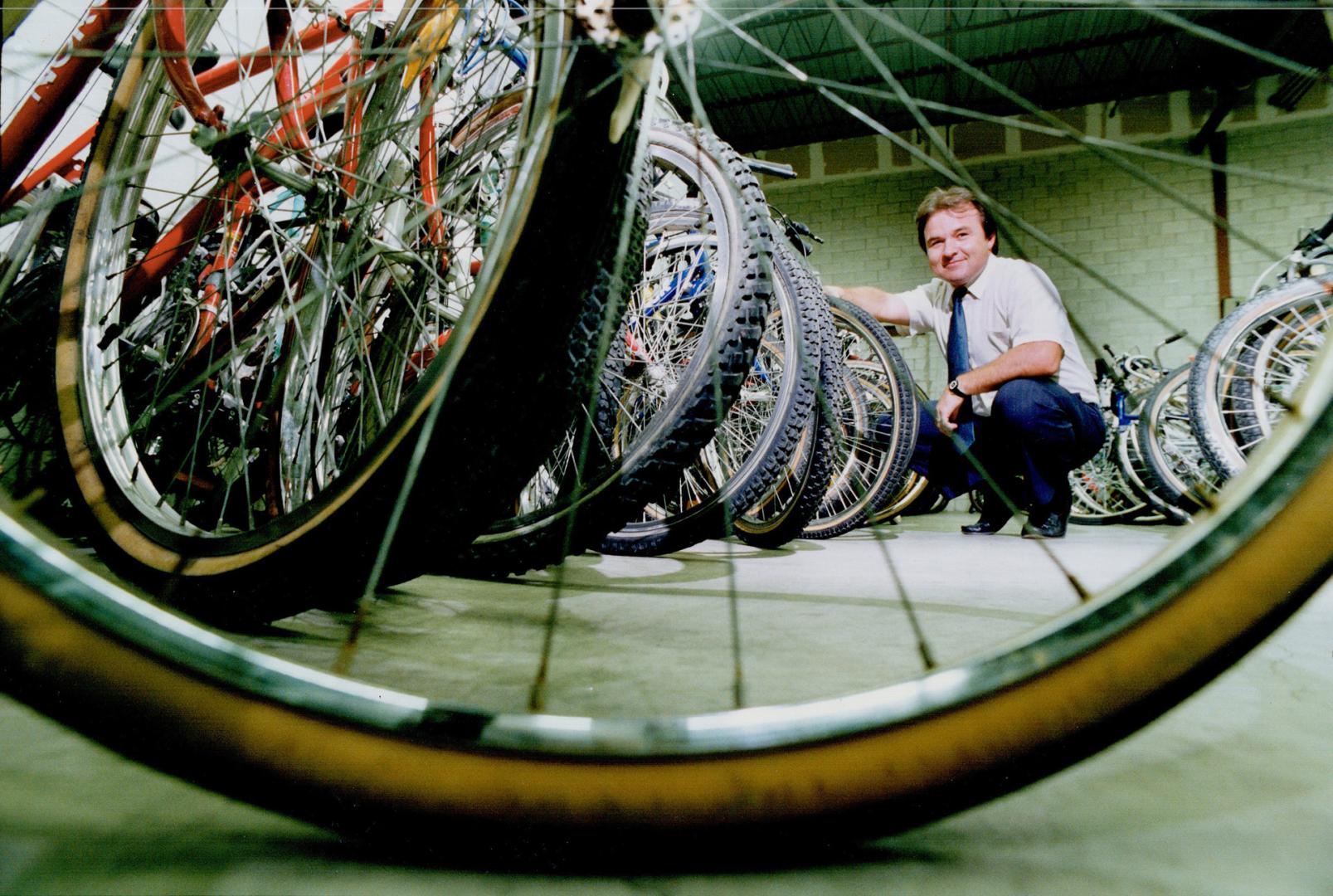 Supervisor Erik Donnelly with bikes lined up for a Metro police auction