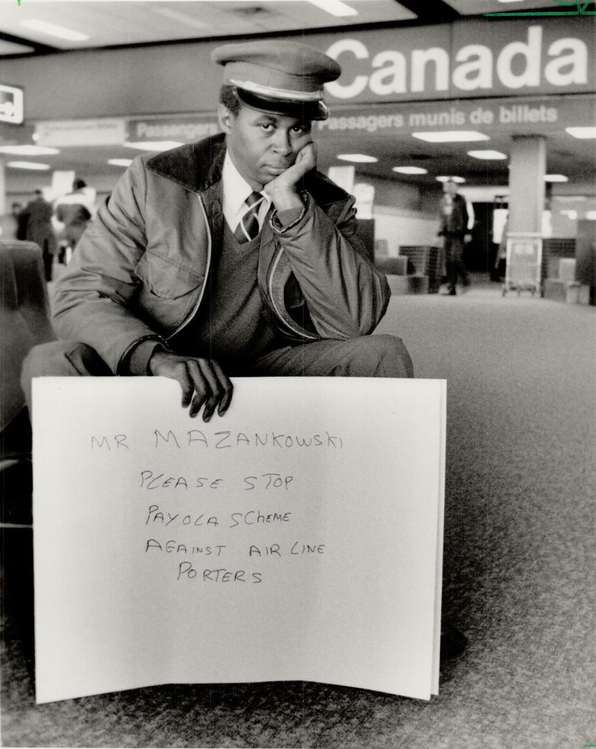 Solo protest: Hilroy Charles, fired as a porter by Allcap Baggage Service Saturday after revealing its pay-to-work scheme to The Star, picketed at Pearson International Airport yesterday