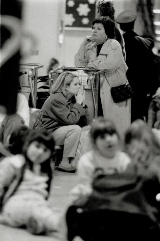 No go: Anna Butt and her mother, Sheila, wait and wait yesterday for their Fort Lauderdale flight from Pearson airport - 12 hours in all