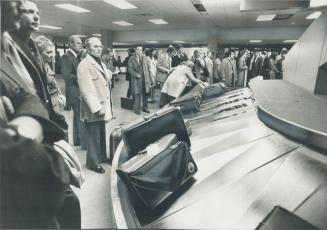 Terminal 2 passengers wait for their luggage yesterday, as they were among the first to use the new $42 million terminal which Air Canada began operat(...)