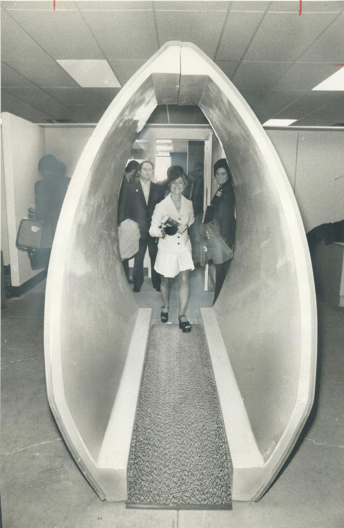 Doris Boudreau walks through one of the detectors at Toronto International Airport's new Terminal 2 yesterday