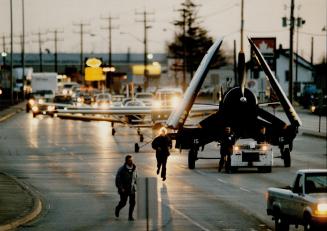 A world war II navy Corsair, on loan from the War Heritage Museum, leads six aircraft along Derry Rd