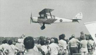 Flights of yore remembered. A Throxton Jackaroo lands on the Brampton Flying Club's field yesterday at the third annual All-Canadian Air Show in Bramp(...)