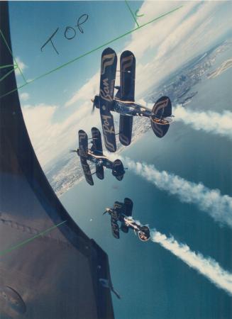 Soaring over Lake Ontario are two of the Pitts S-2b biplanes from the Ray Ban Gold Aerobatic Team, part of the International Air Show at the CNE that (...)