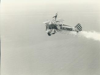 Flying Pierces: Wayne drives '37 Stearman biplane while wife Carol goes wing-walking