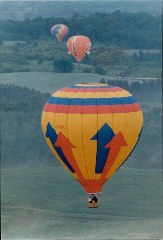 Balloon with a view. Hot air balloons converge over Newmarket for annual festival yesterday. Airborne fun continues today with rides and helicopter flights available to the public