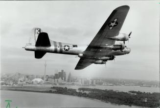 Island Fortress. A veteran B-17 Flying Fortress bomber wheels over Lake Ontario as it prepares to land at the Toronto Island Airport yesterday. The Wo(...)