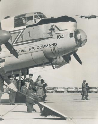 Last of the Lancs. Airman lowers flag in salute to famed World War II bombers - the Avro Lancasters - the last four of which were retired from RCAF se(...)