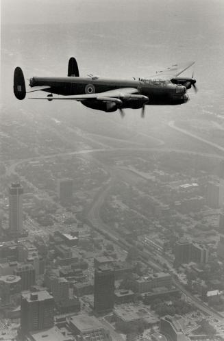 Salute to past: A restored Avro Lancaster bomber takes a run over Hamilton yesterday in preparation for the Hamilton international Air Show, June 17-18