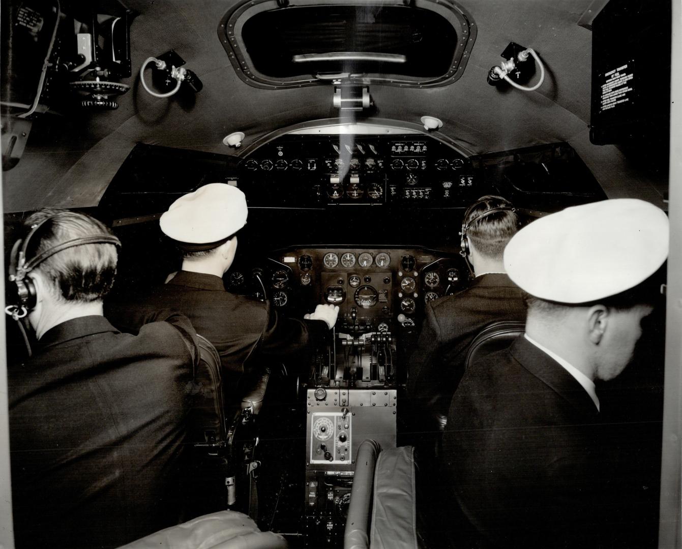 This photograph shows four of the six crew members of a Strato-Clipper