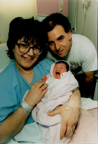 Cathy and Anthony Minchella and daughter 1 second after midnight