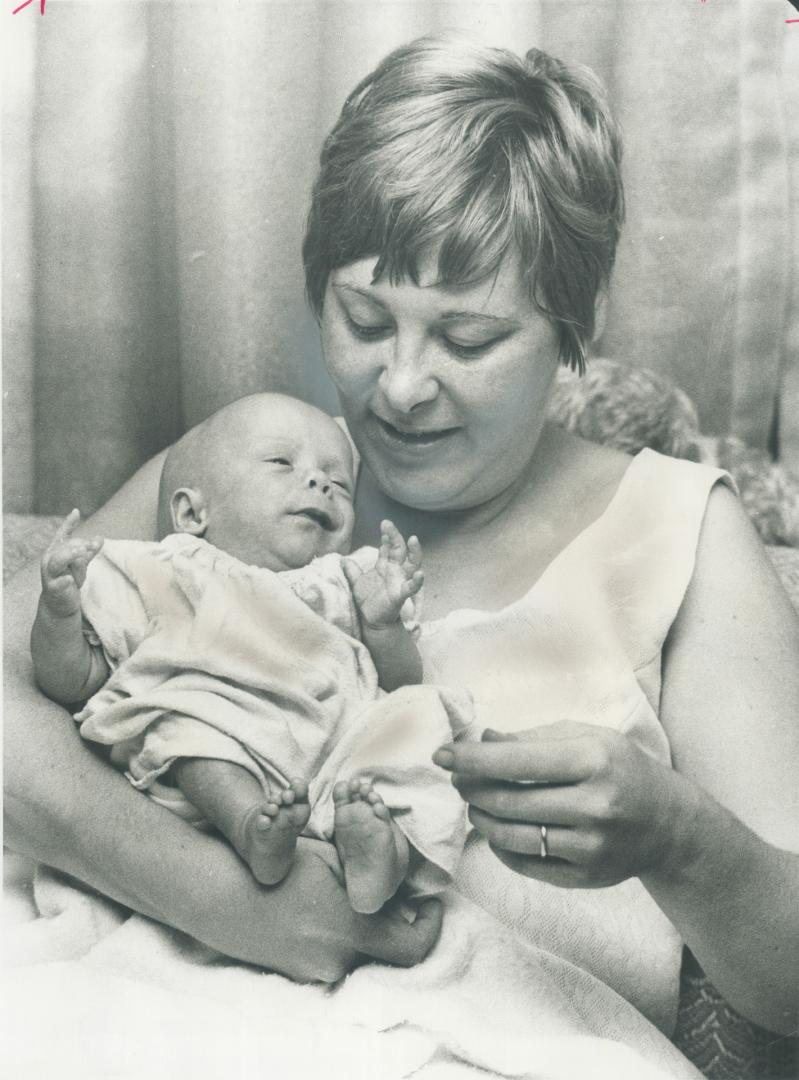 The smallest baby goes home. The smallest baby ever cared for at the Hospital for Sick Children, Jeffrey Lawrence Croft, is home with his mother, Mrs.(...)