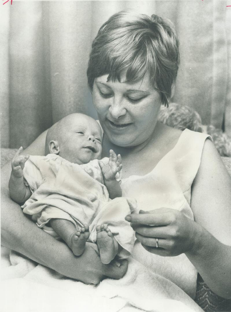 The smallest baby goes home. The smallest baby ever cared for at the Hospital for Sick Children, Jeffrey Lawrence Croft, is home with his mother, Mrs.(...)