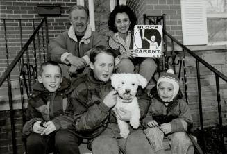 Family affair: The Turpins believe in Block Parents - Aaron, 8, Devon, 11, (with Max), Dale, 3, with parents Ron and Allison