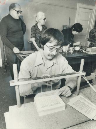 Gilles Tremblay is learning book-binding at the Galerie