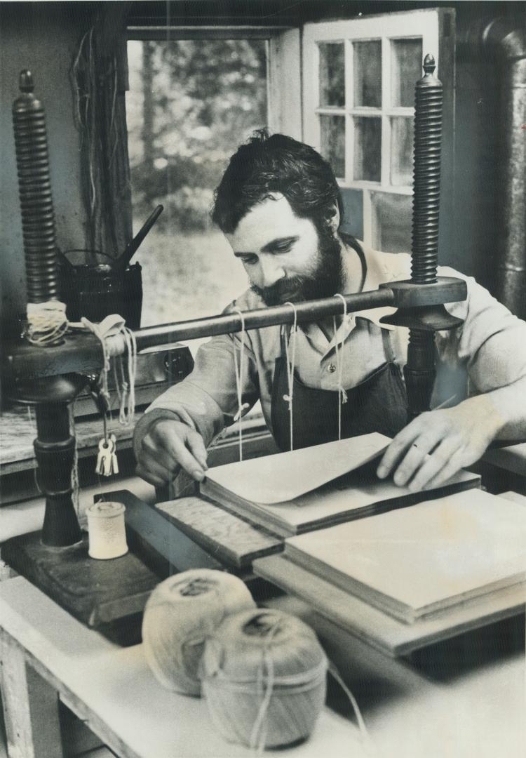 Master book restorer Michael Wilcox repairs books meticulously by hand, as it was done 200 years ago in a shop near Peterborough