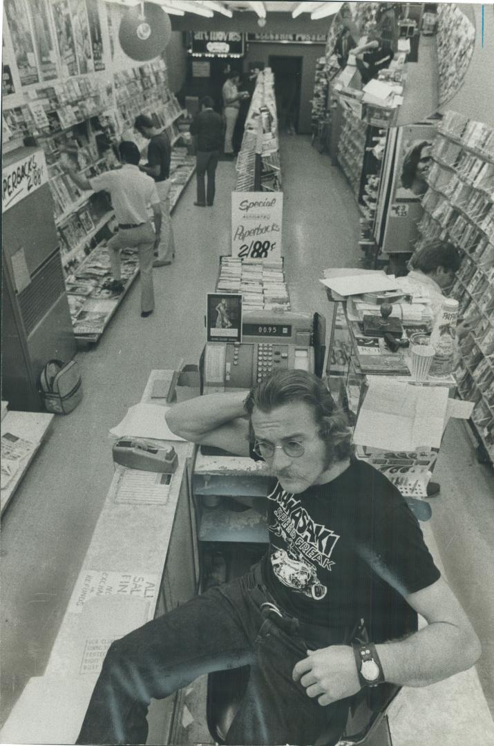 Yonge St. Strip is the focus of most of the city's after-hours activity. One of the busiest places there is Reid's Bookstore. Here, John Seckar, 28, t(...)