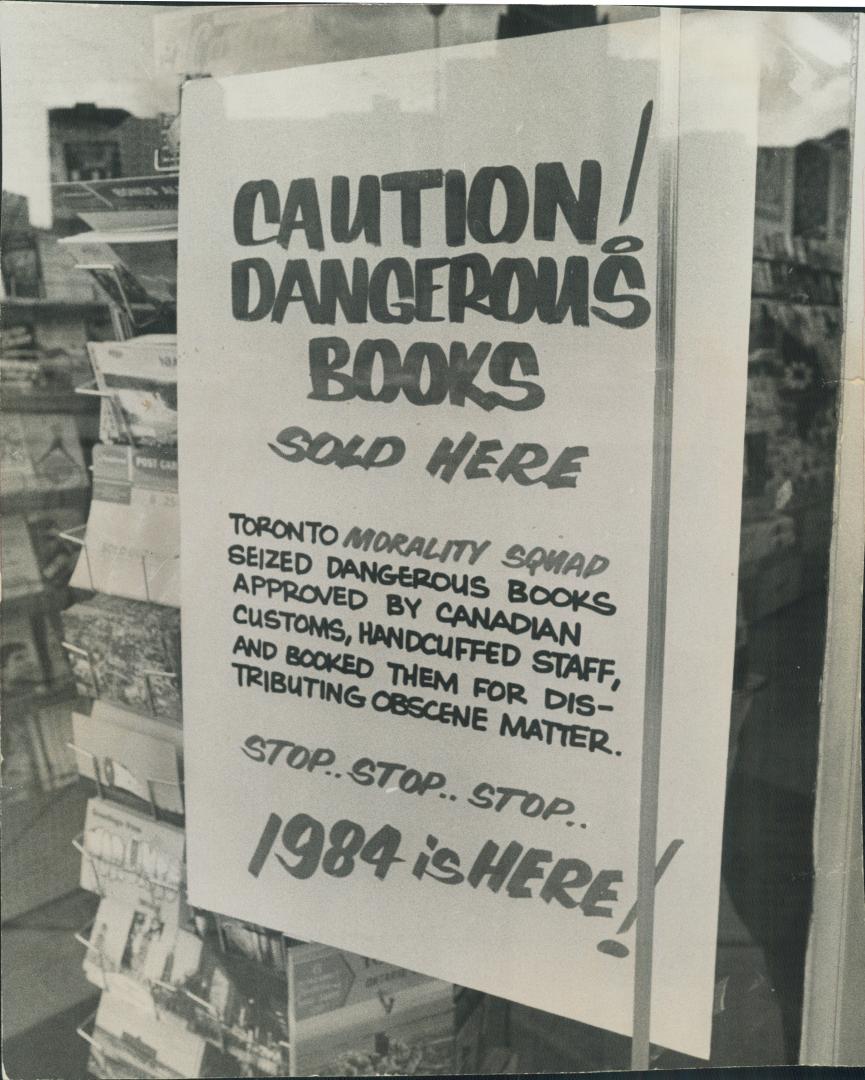 Handcuffs lock a book store. This closed sign on door of Reid Book Store, on King St., follows two police raids on the store last week, in which emplo(...)