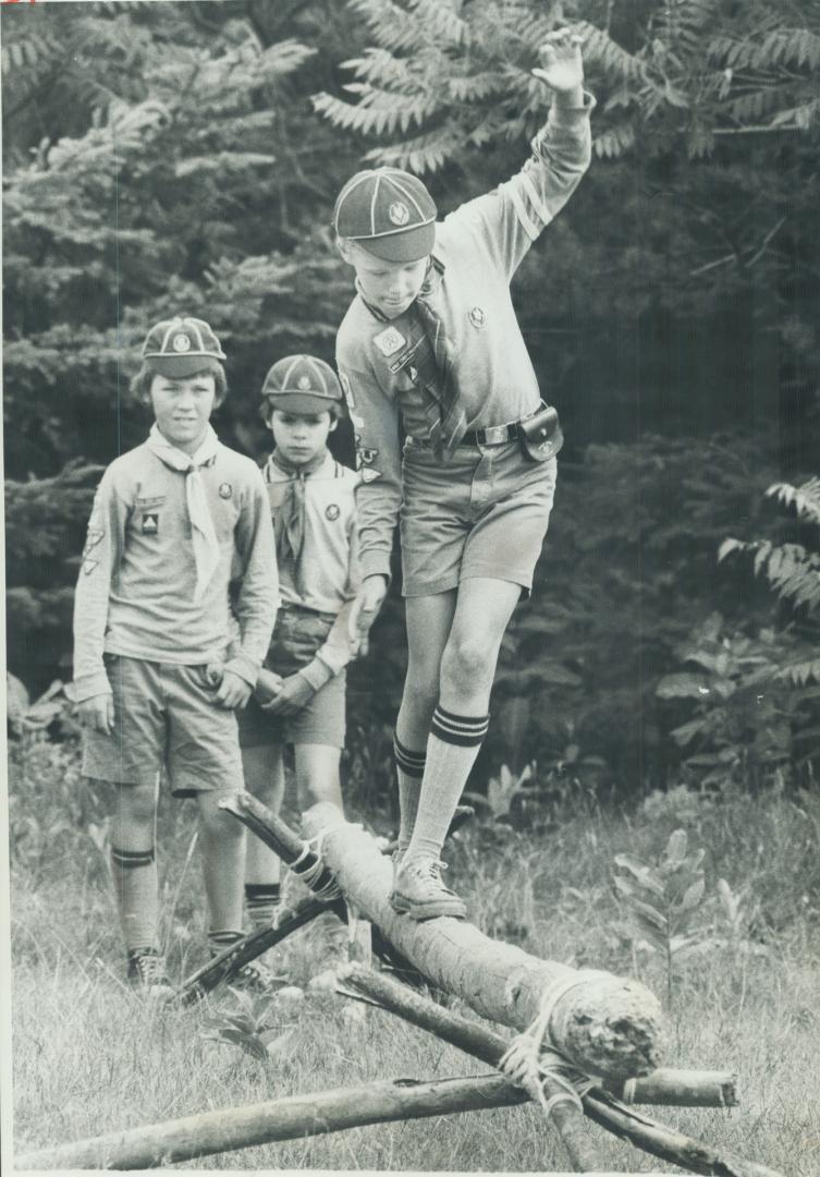 Readers, below, reject criticism of the Scouting movement and point out the benefits to the young people and the community. Above, Wolf Cubs, second-youngest group in Scouting, at camp in Aurora