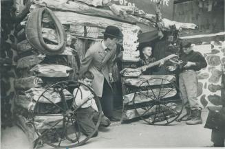 Blacksmith shop of 100 years ago is worked on by North York's Lillian Street public school students, from left, Ricky Dumouche, 10, David Mack, 10, an(...)