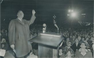 Premier John Robarts presents the switch that set off Ontario's firework display as Centennial Year got underway in the province. The premier also lit(...)