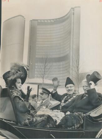 Off on a centennial spin. Centennial celebrants Controller June Marks, Mayor William Dennison and Oakah Jones, Centennial Committee chairman, set out (...)